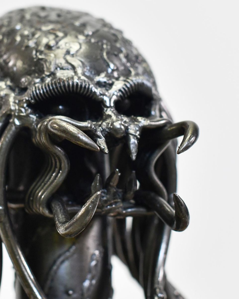 Close Up Of Metal Alien Head Sculpture Close Up Of Metal Alien Head Sculpture