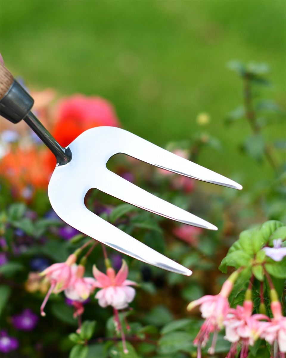 Stainless Steel Garden Hand Fork Close Up Stainless Steel Garden Hand Fork Close Up