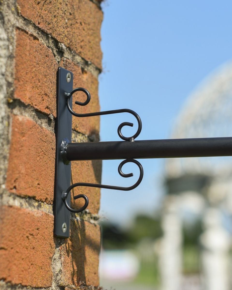 Close up of ornate mounting bracket on "A Hen and Her Chicks" Weathervane