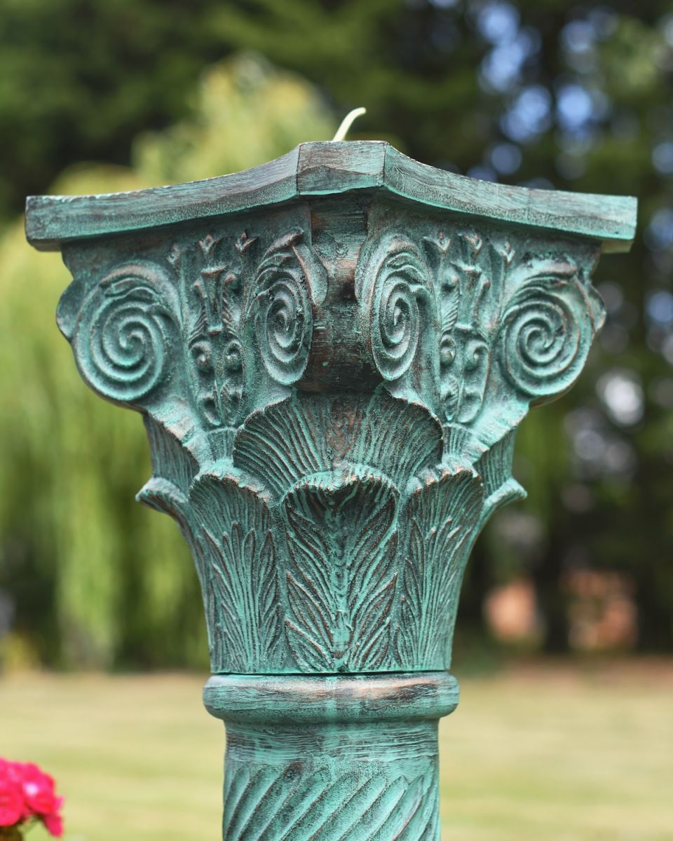 Close up of ornate detailing on garden plinth