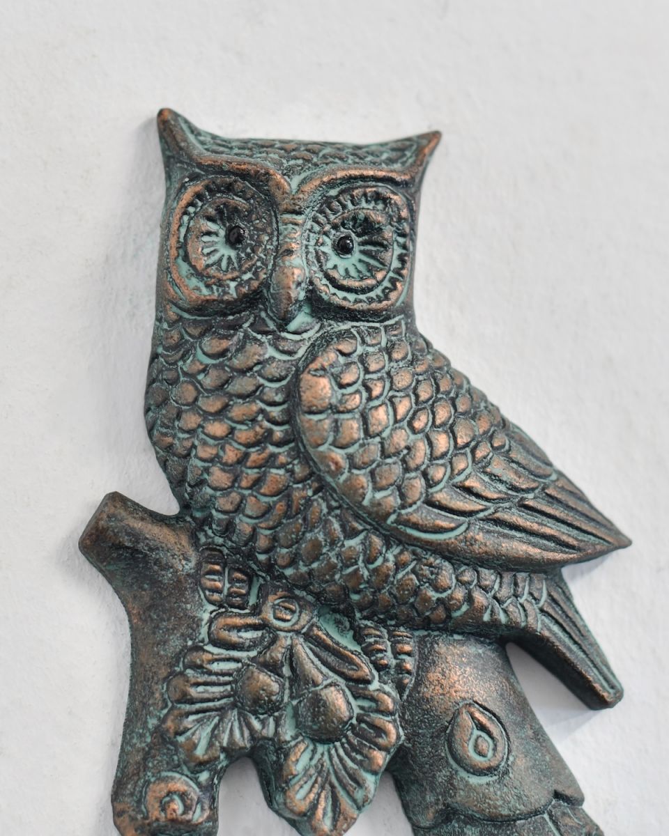 Close up of intricate owl detail on woodland verdigris coat hook