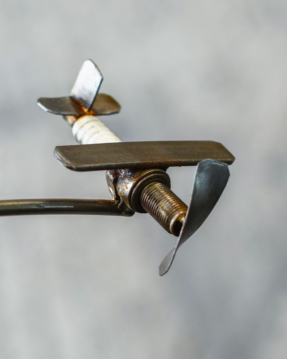 Close up of intricate plane detail on scrap metal home decor sculpture