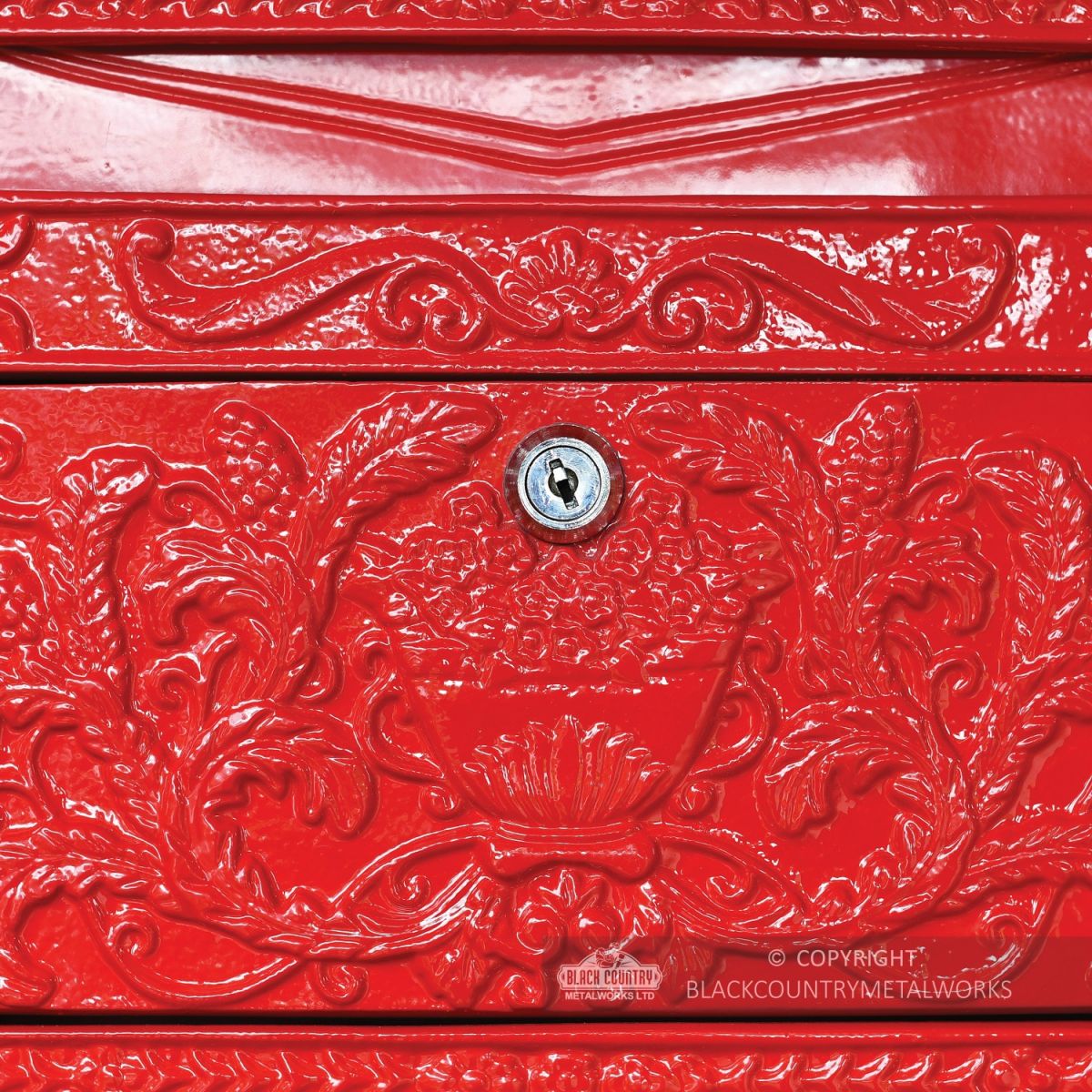 Close-up of the Ornate Design on the Front of the Post Box