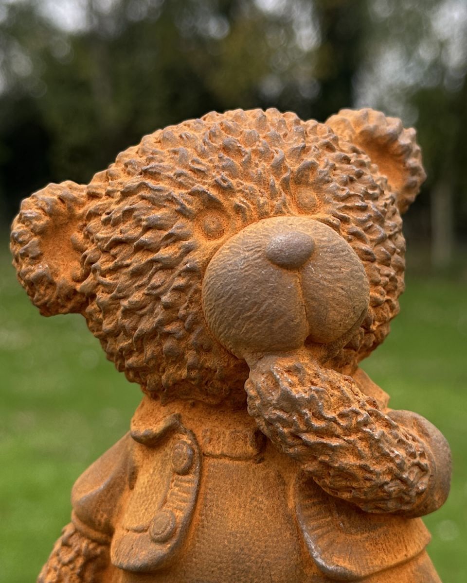 Close up of intricate detailing on teddy bear garden sculpture Close up of intricate detailing on teddy bear garden sculpture
