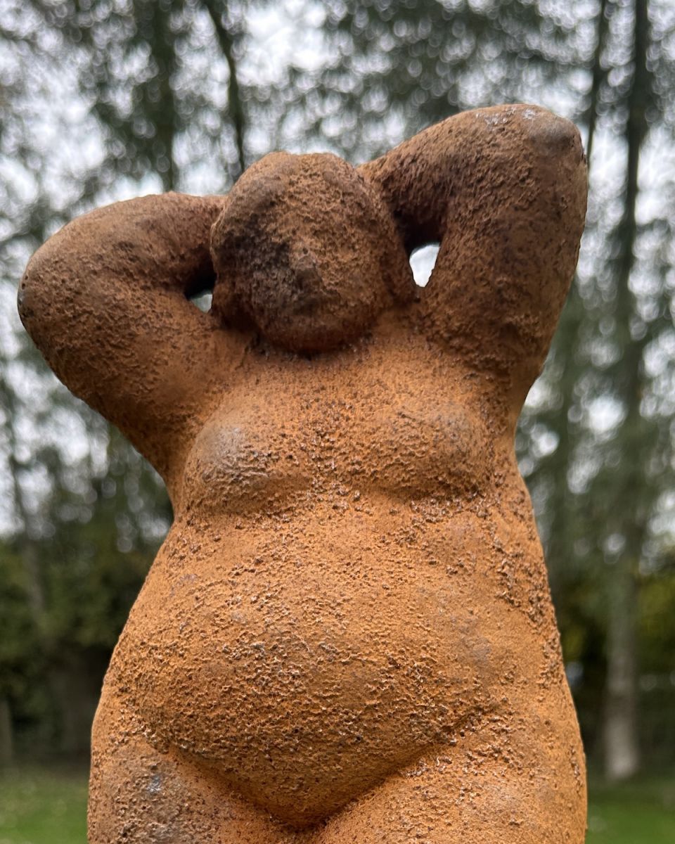 Close up of intricate detail on rustic finish garden statue Close up of intricate detail on rustic finish garden statue