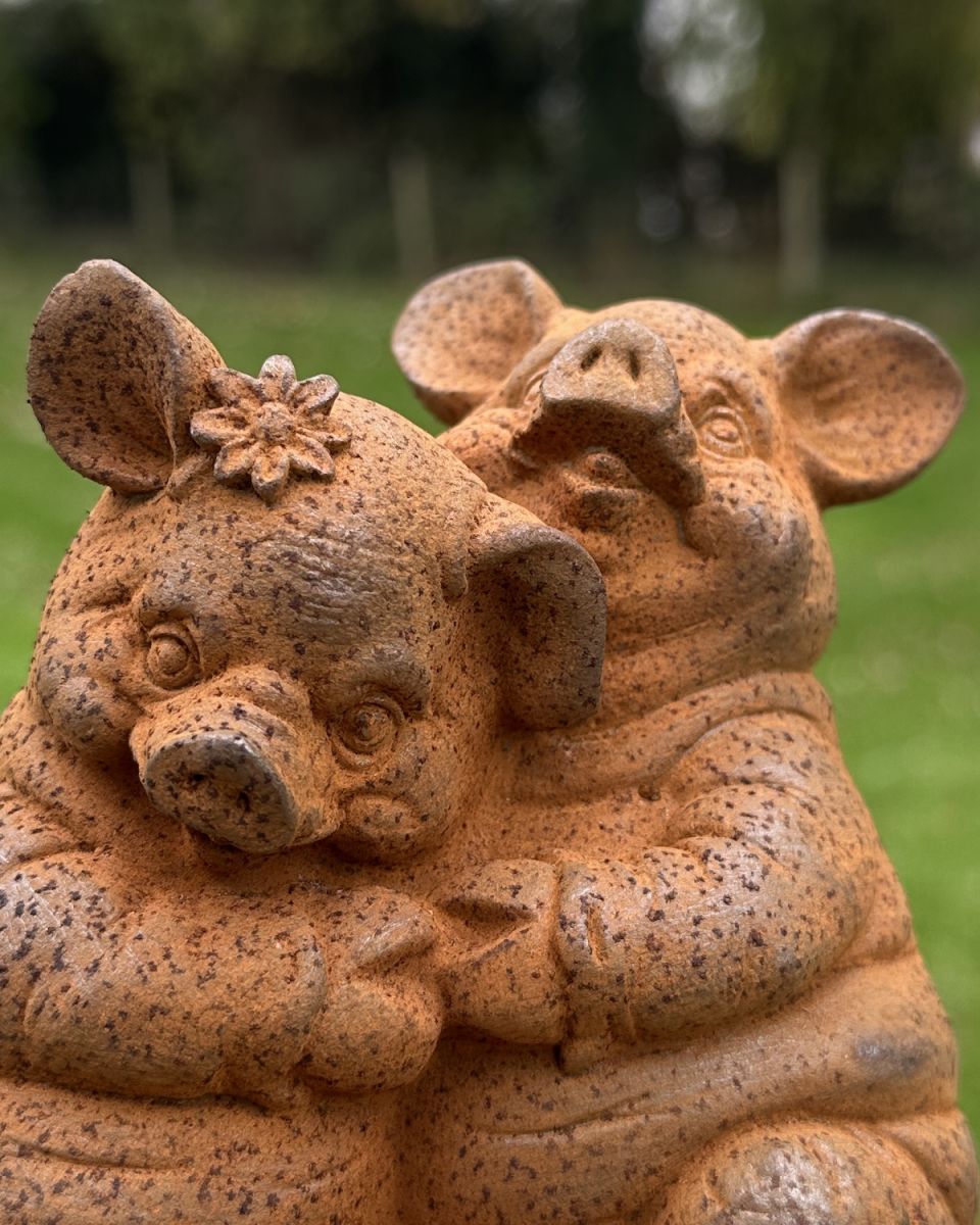 Close up of intricate detail on rustic finish pig sculptures