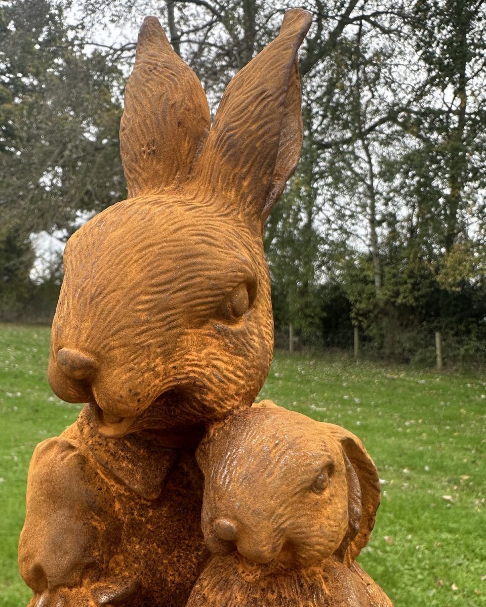 Close up of Rustic Cast Iron "Juniper and Thumper" Rabbit Sculptures
