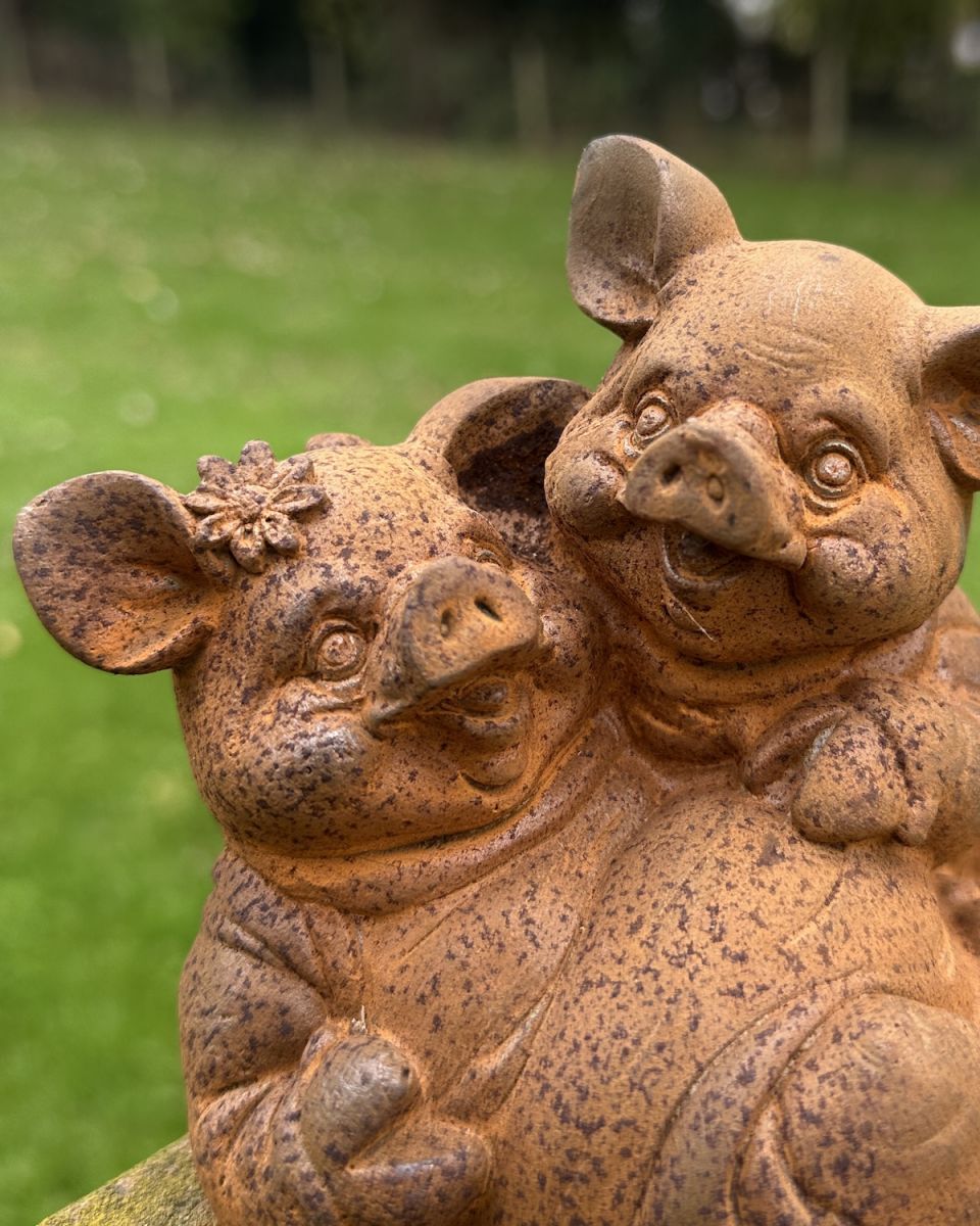 Close up of intricate detail on rustic finish pig garden sculpture