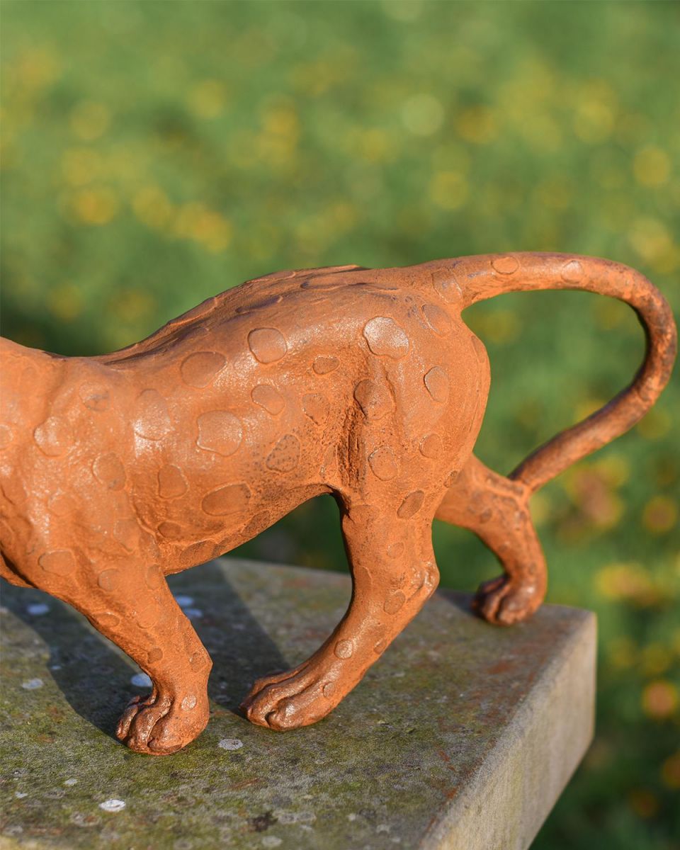 Close Up of Rustic Leopard Garden Sculpture