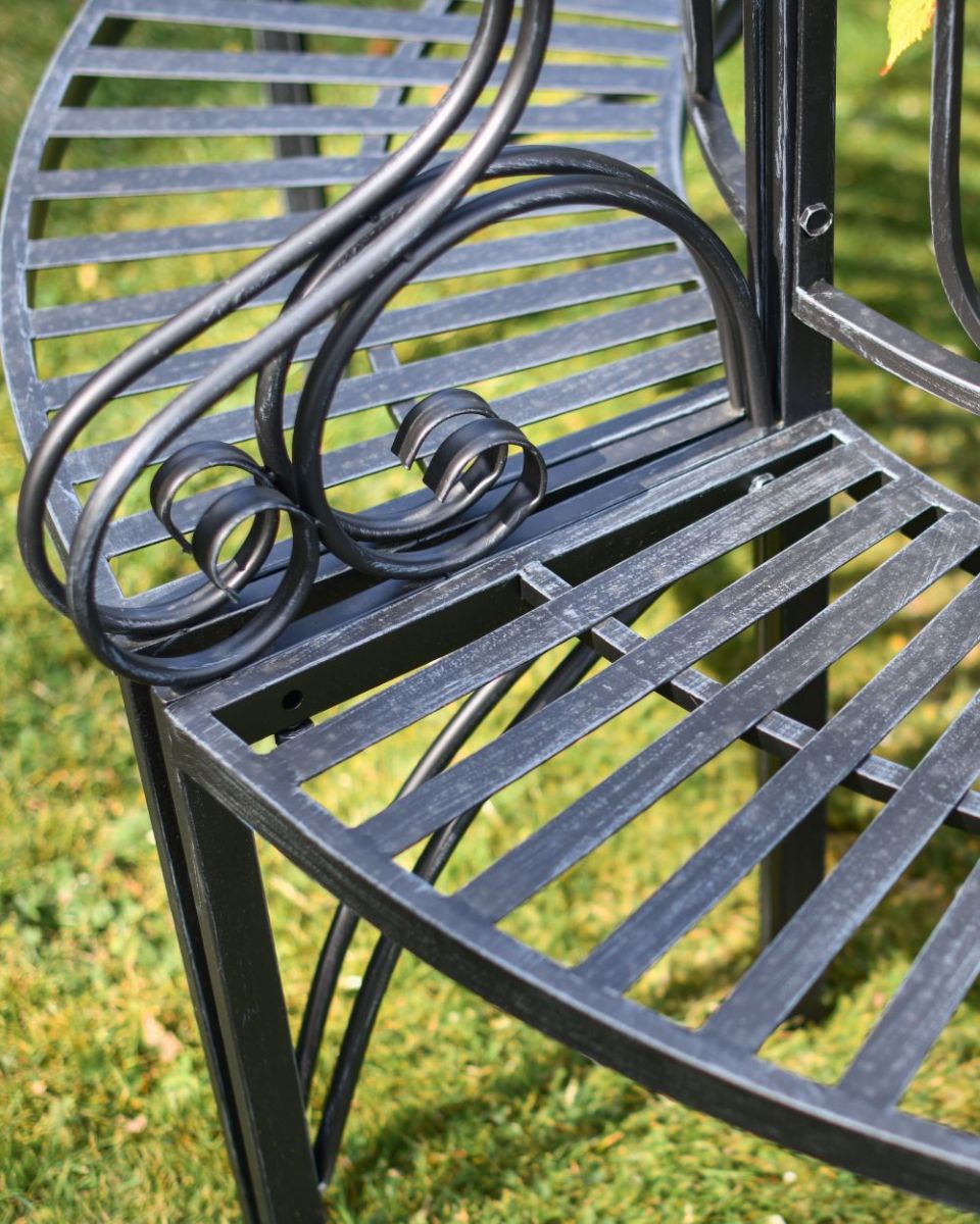 Close up of scroll detailing on seat arms