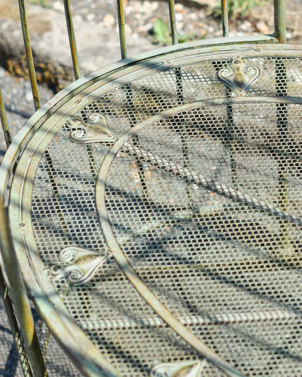 Close up of intricate seat detail on outdoor arbour bench
