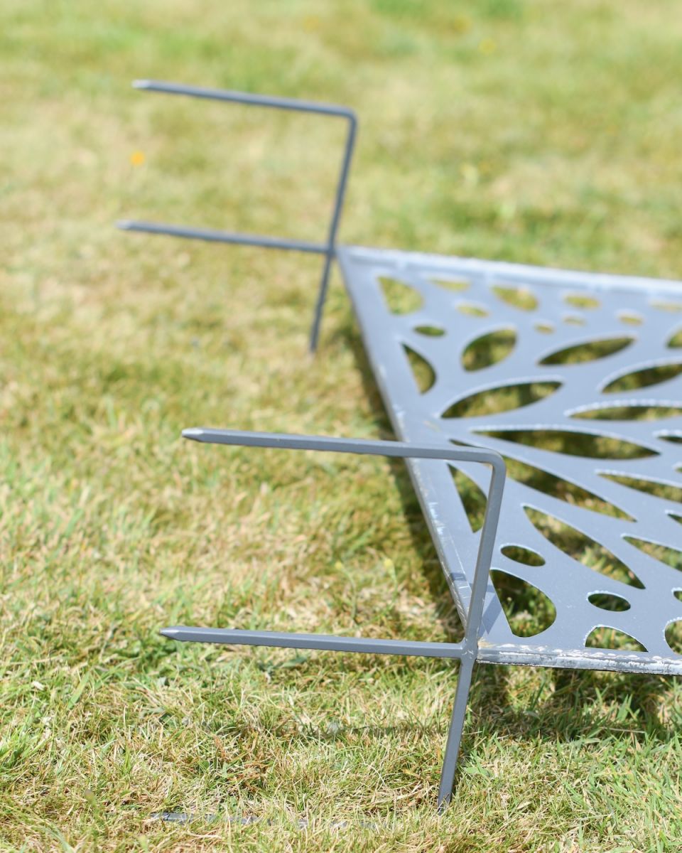Close up of ground spike detail on decorative garden screen