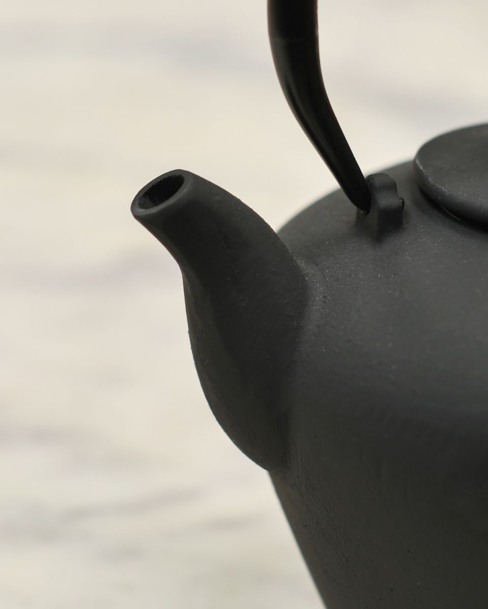 Close up of spout detail on traditonal teapot Close up of spout detail on traditonal teapot