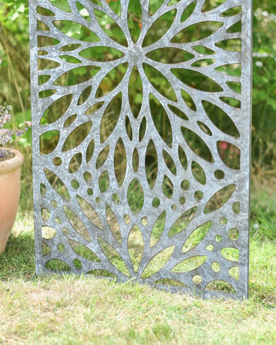Close up of intricate cut out detail on freestanding garden screen