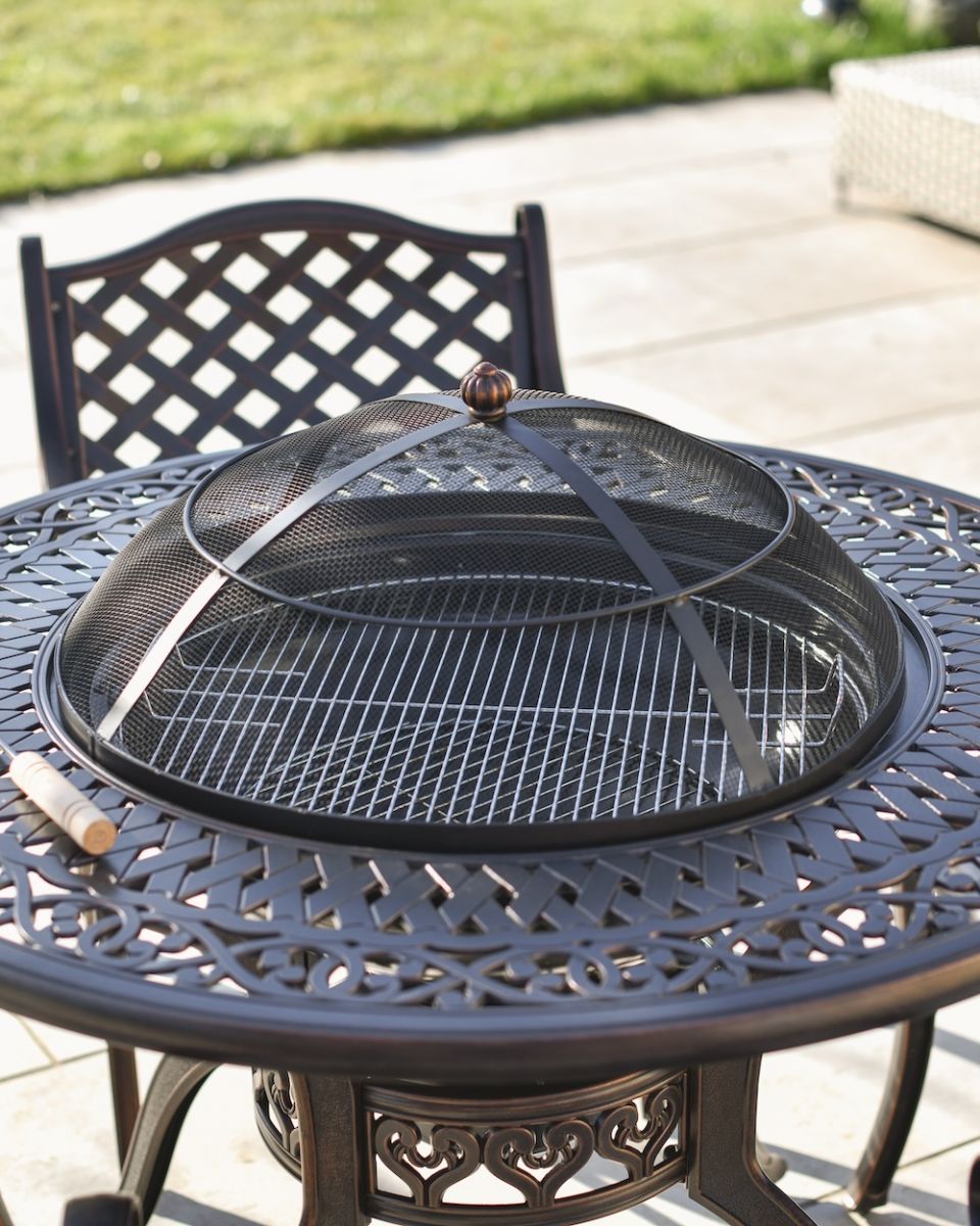 close up of round table detail with bbq centre close up of round table detail with bbq centre