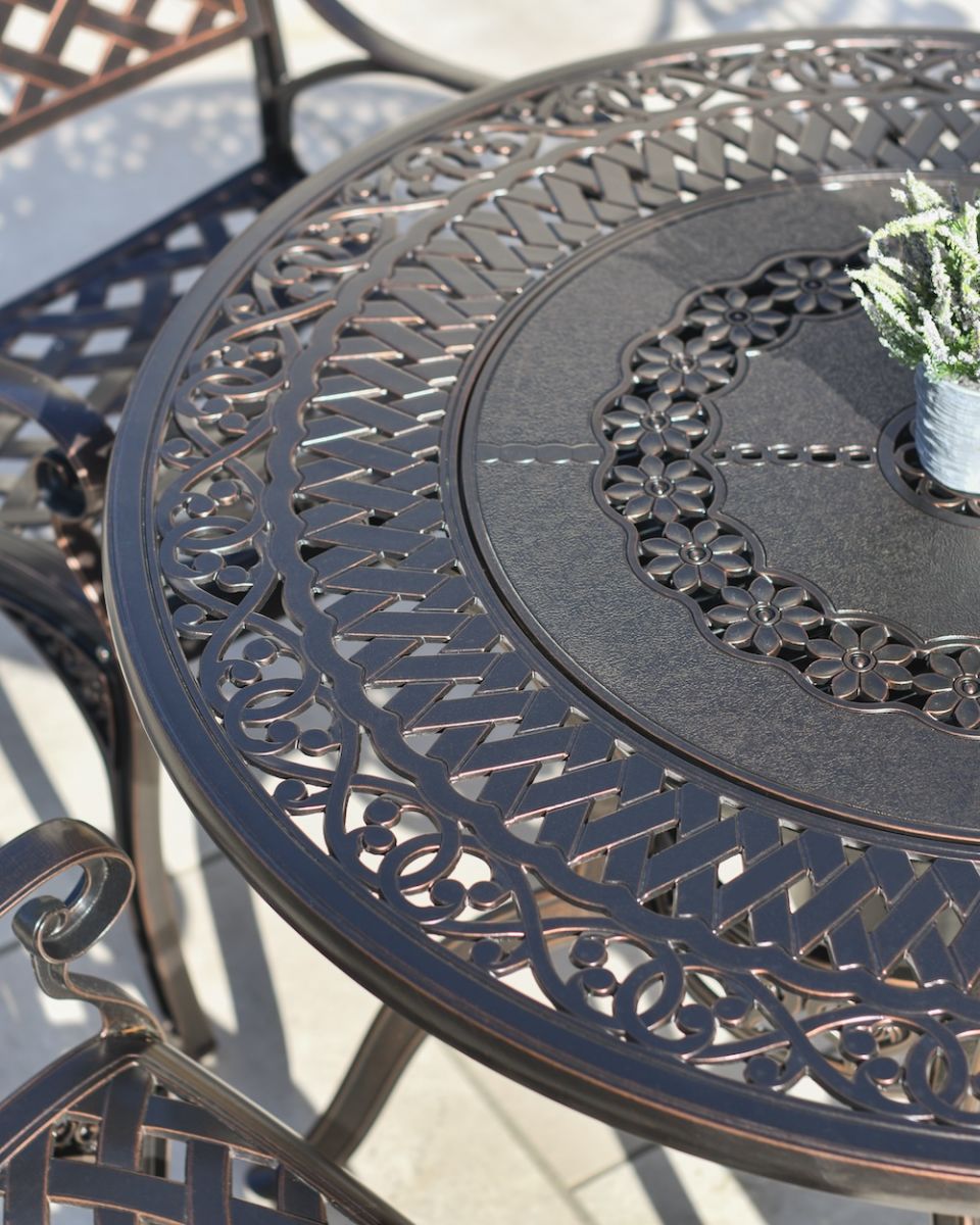 close up of table top detail on garden furniture dining set close up of table top detail on garden furniture dining set