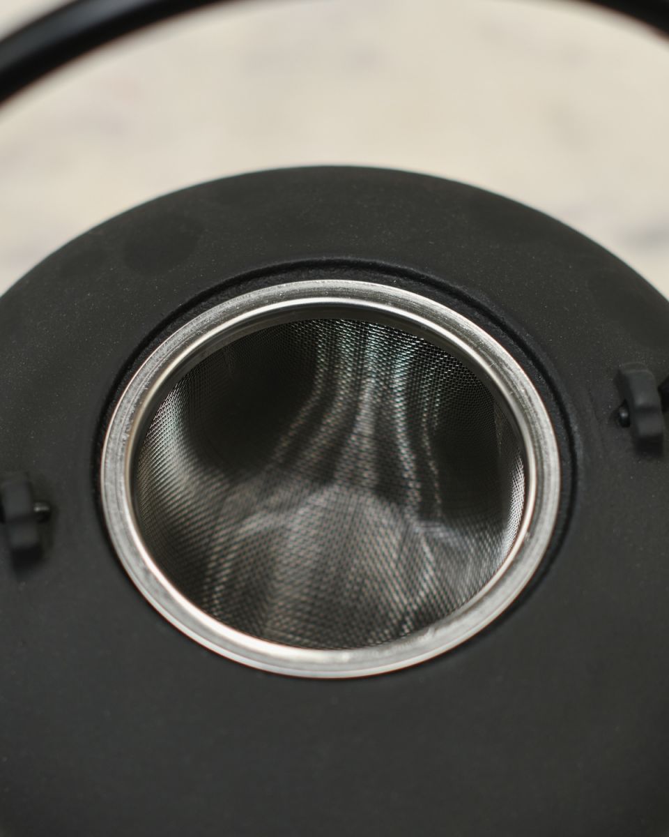 Close up of tea strainer detail on Matte Black Cast Iron Teapot Close up of tea strainer detail on Matte Black Cast Iron Teapot