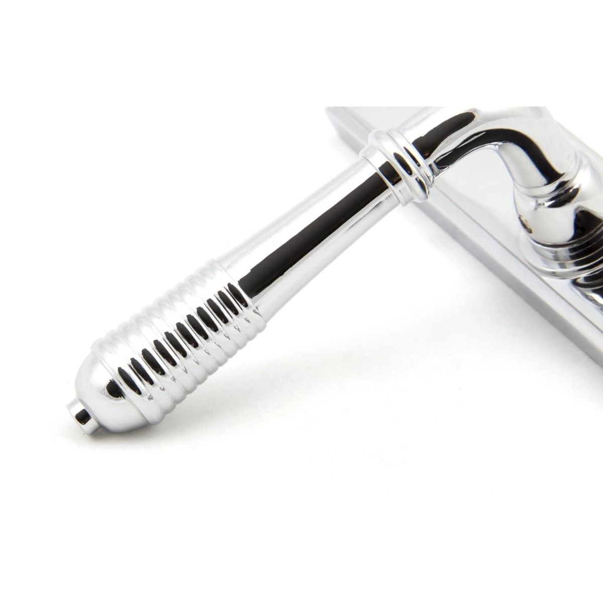 Close up of the Handle of the Reeded Slimline Lever Espagnolette Door Latch in Polished Chrome
