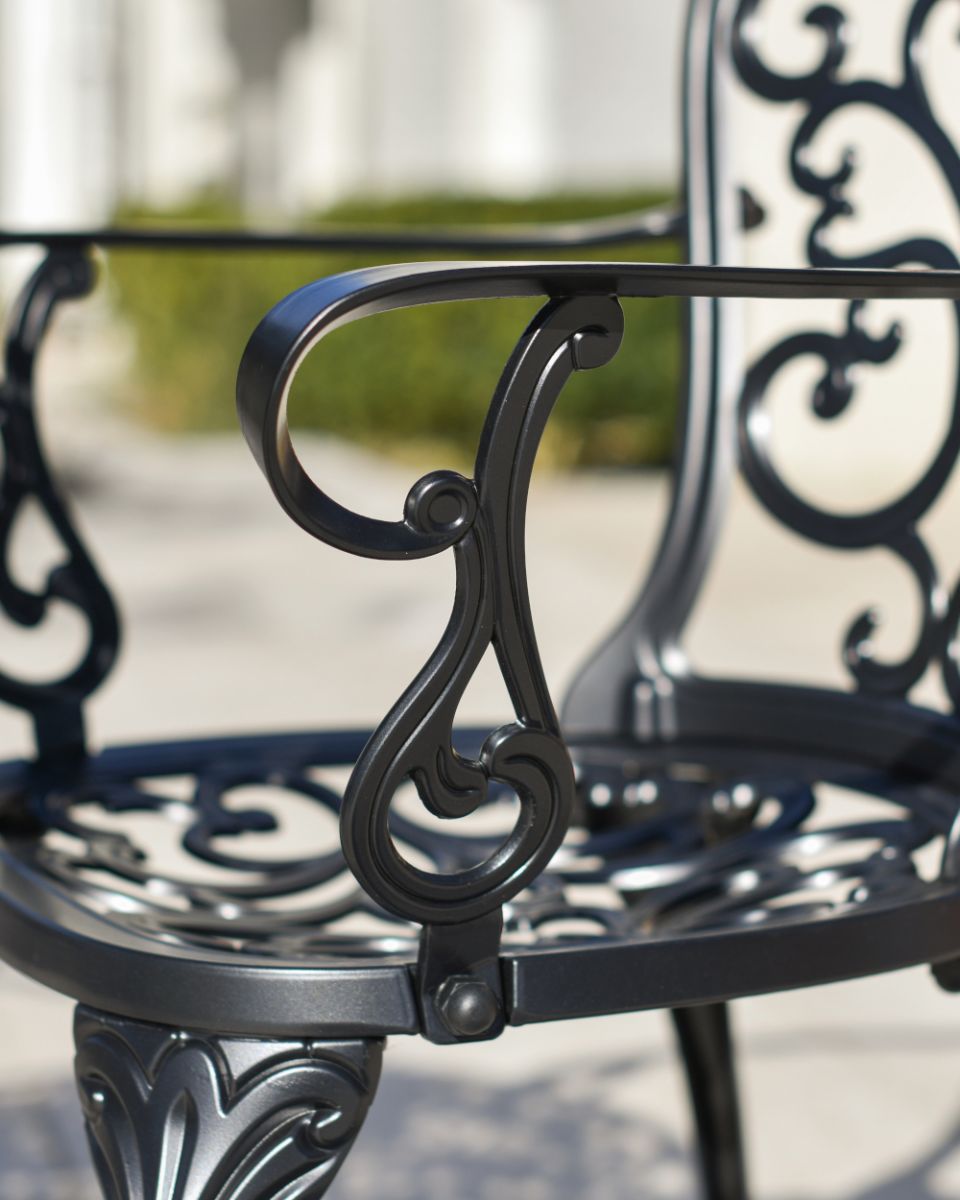 Details On The Arms Of The Chairs From The Aged Black Harlington Furniture Set