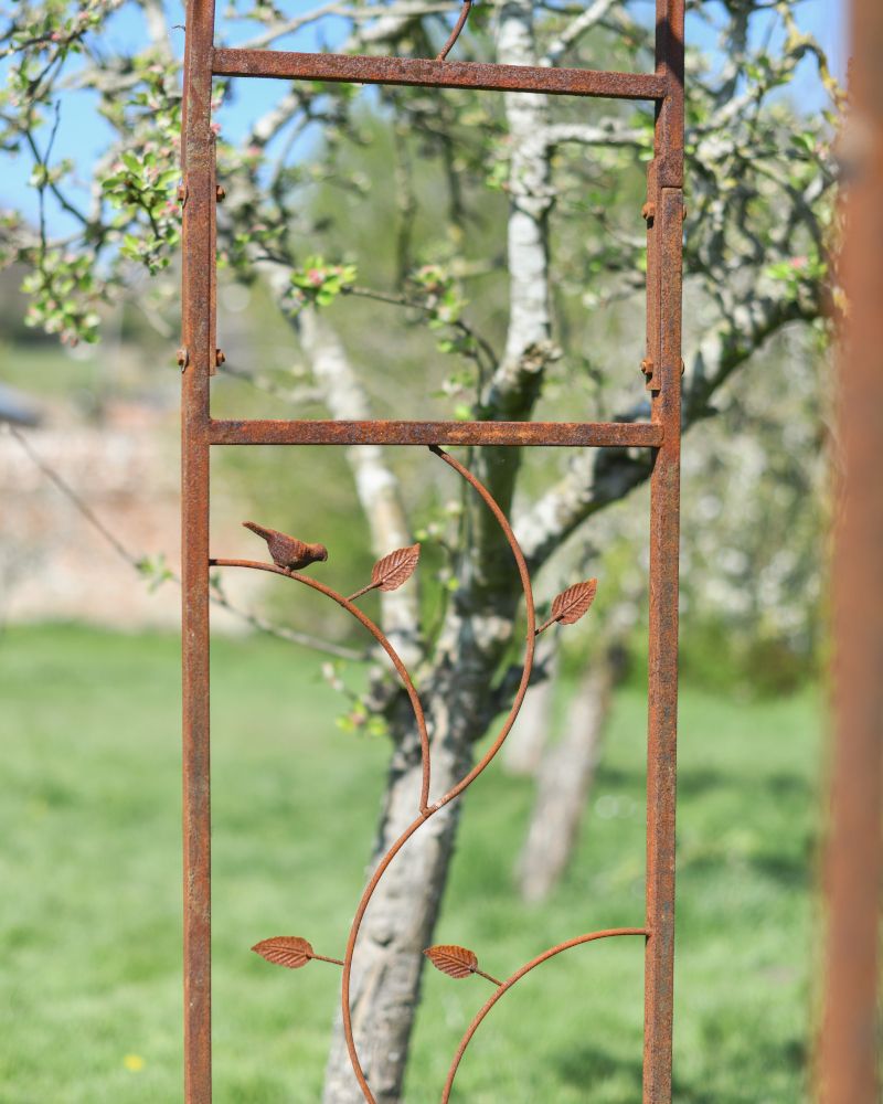 Close-up of the Bird and Leaf Design Around the Rose Arch