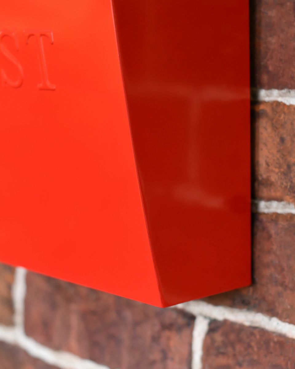 Close Up Of The Red Finish On The Modern Post Box