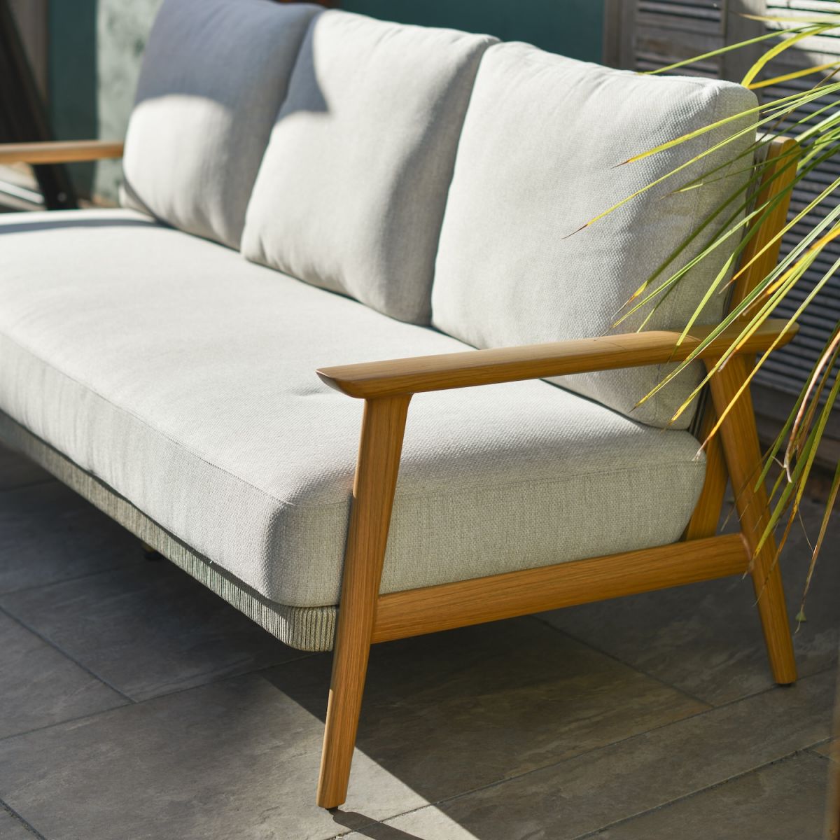 Close up of three seater sofa on five seater outdoor lounge furniture set