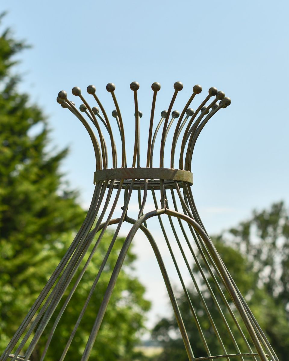 Close up of ornate top detailing on rustic arbour