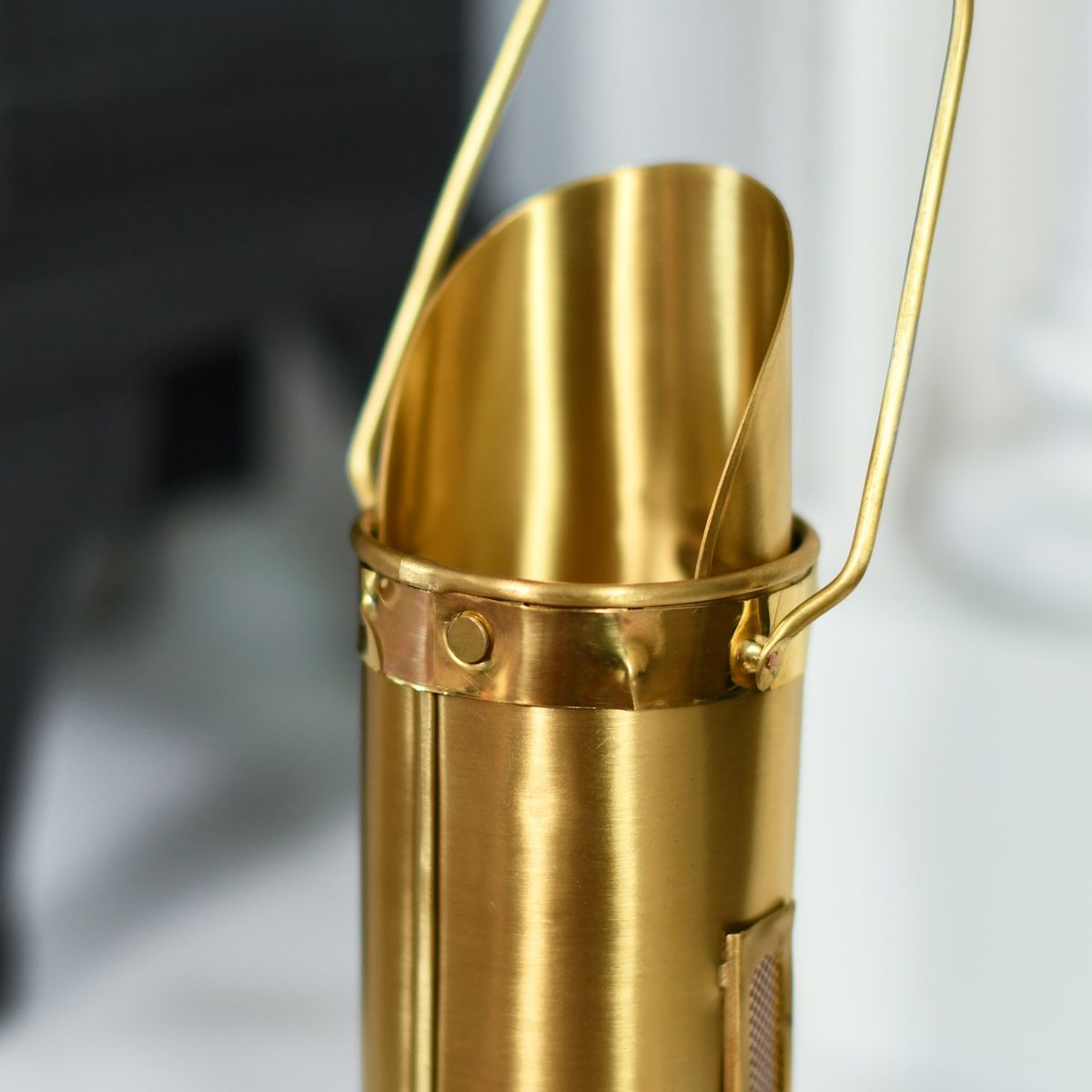 Close up of top of brass match holder