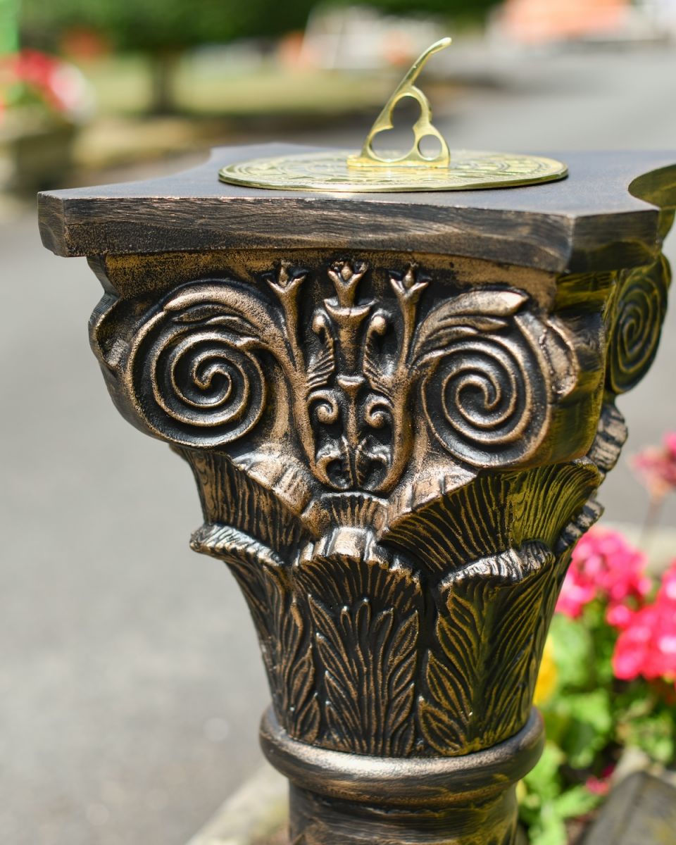 Close up of ornate detailing on garden plinth