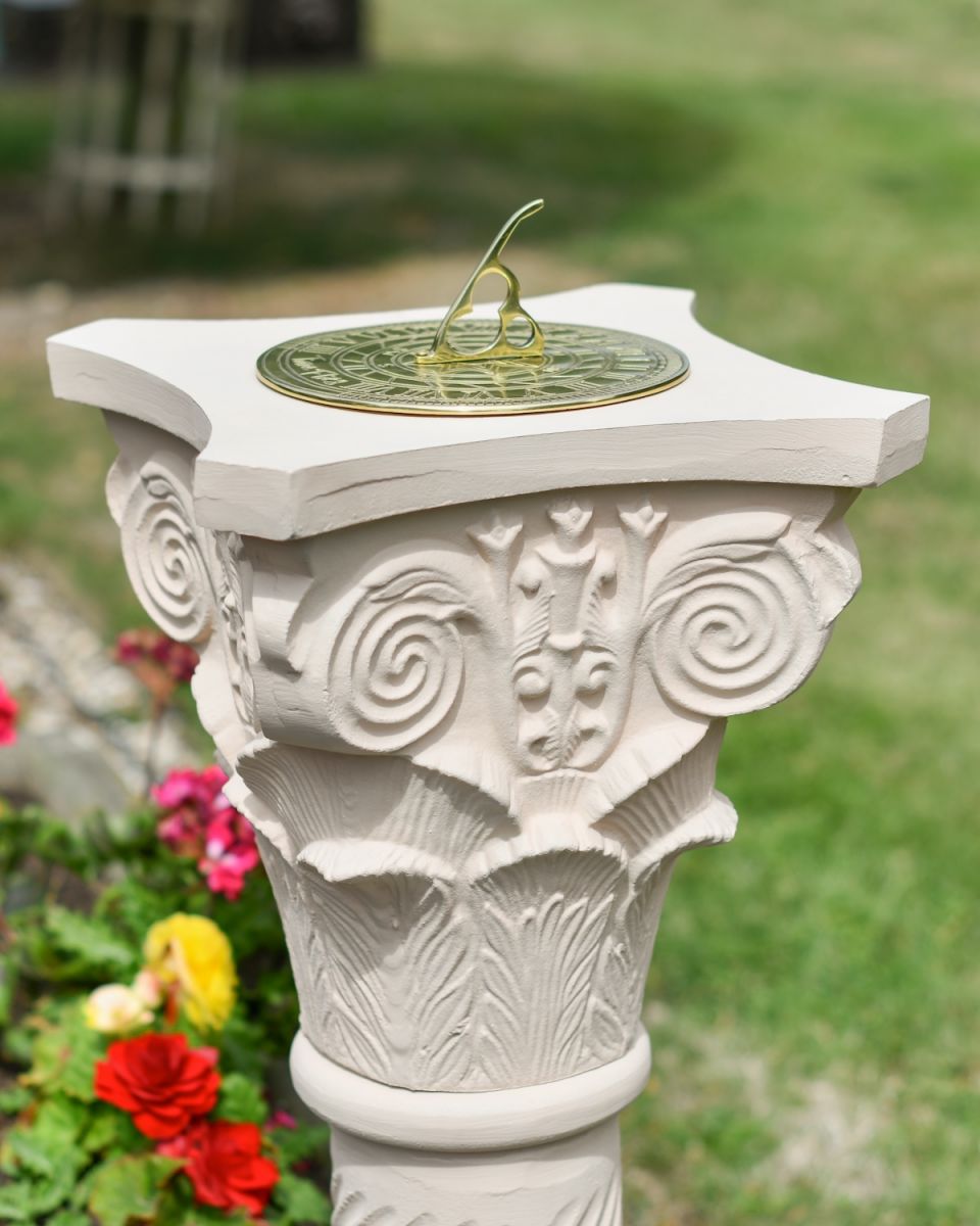 Close up of ornate detailing on garden plinth