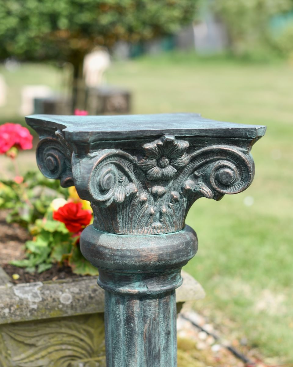 Close up of ornate detail on garden plinth