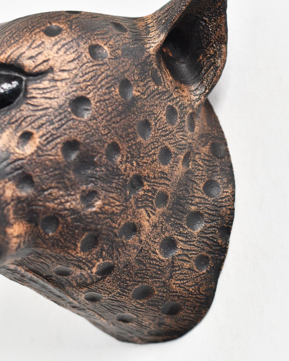 Close up of intricate detail on copper animal wall bust