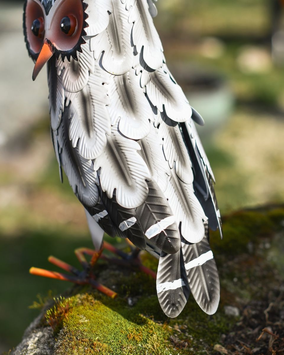 Close up of feather detail on garden bird sculpture