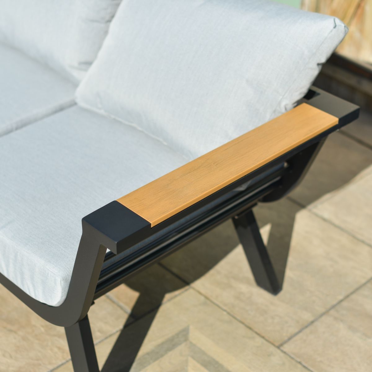 Close up of wood effect detailing on the three seater sofa set on patio lounge furniture set