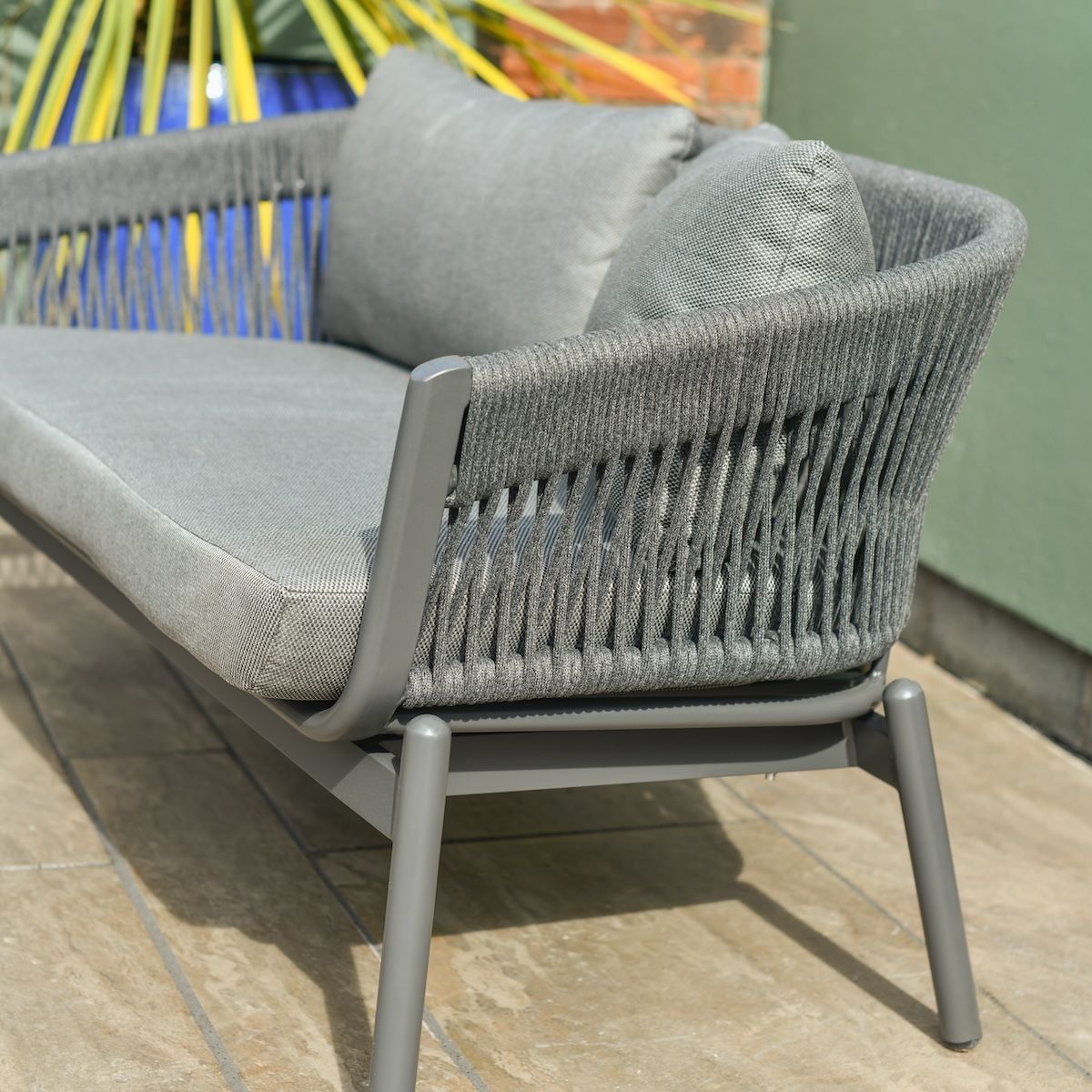 Close up of charcoal grey woven rope detail on five person patio lounge furniture set