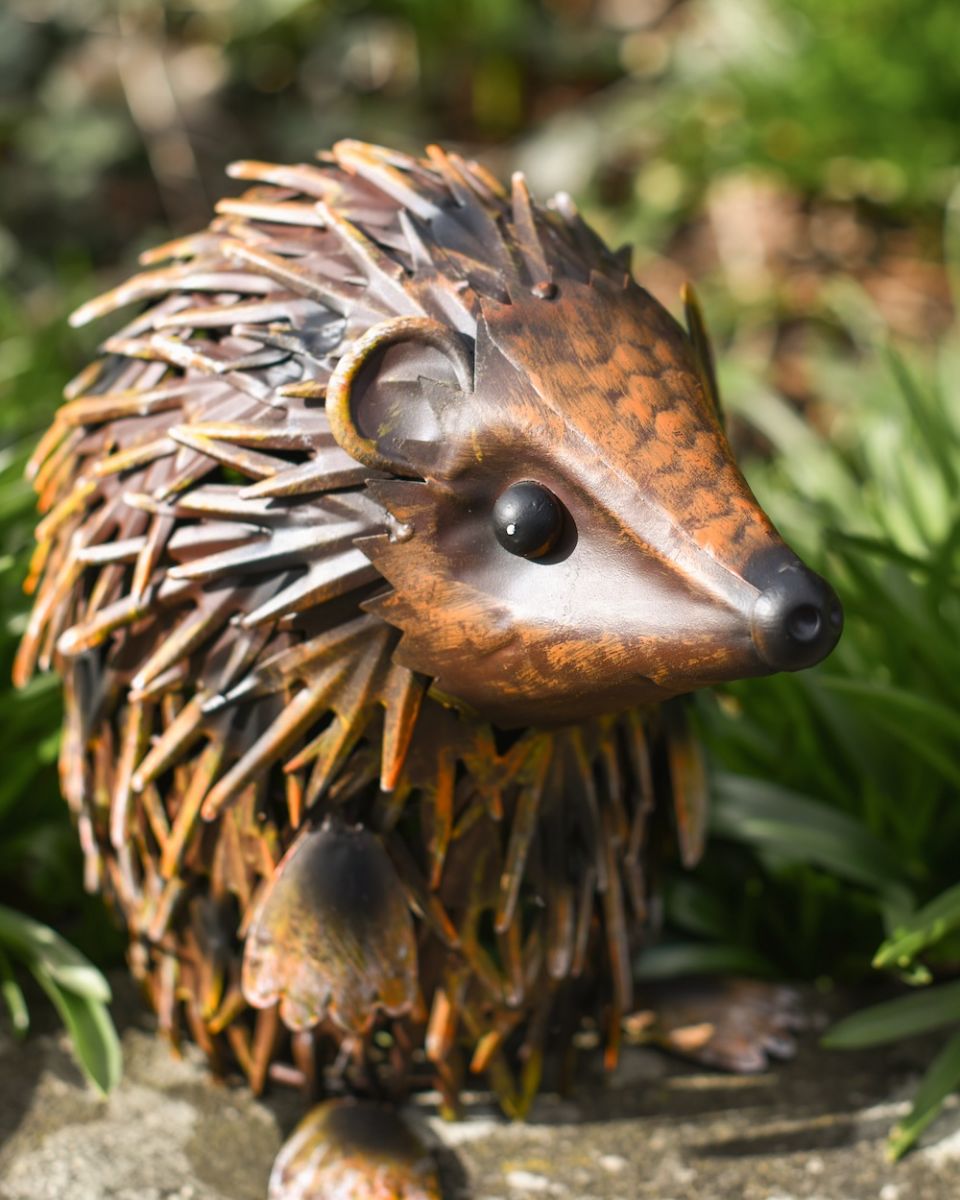 Close up of face detail on handpainted steel garden sculpture Close up of face detail on handpainted steel garden sculpture
