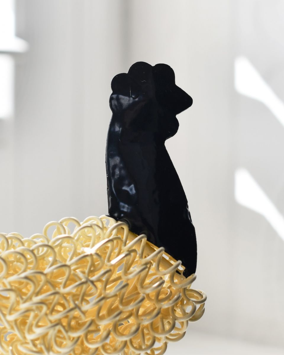 Close up on head detail on recycled cockerel sculpture