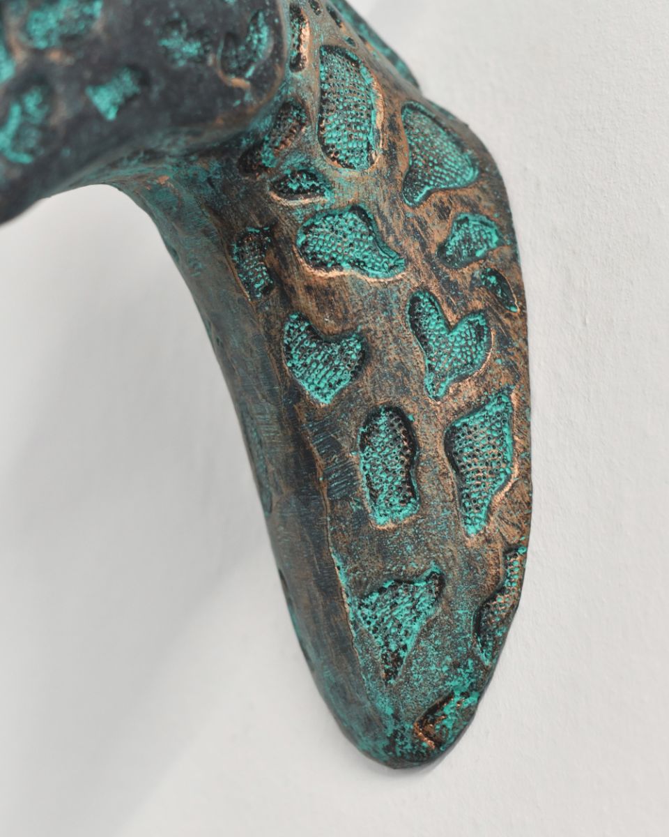 Aluminium Giraffe Head Mounted To The Wall In The Home