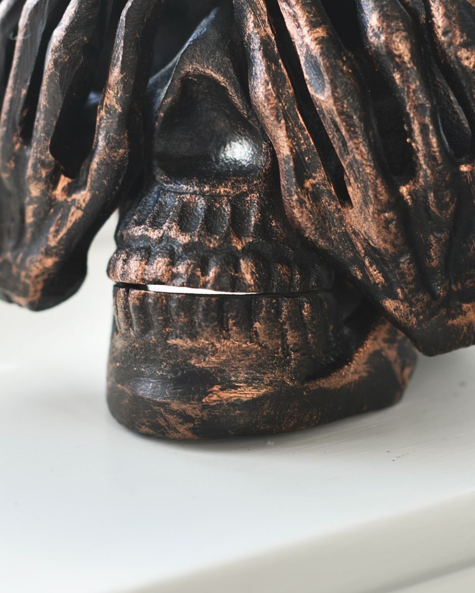close up of bronze skull ornament