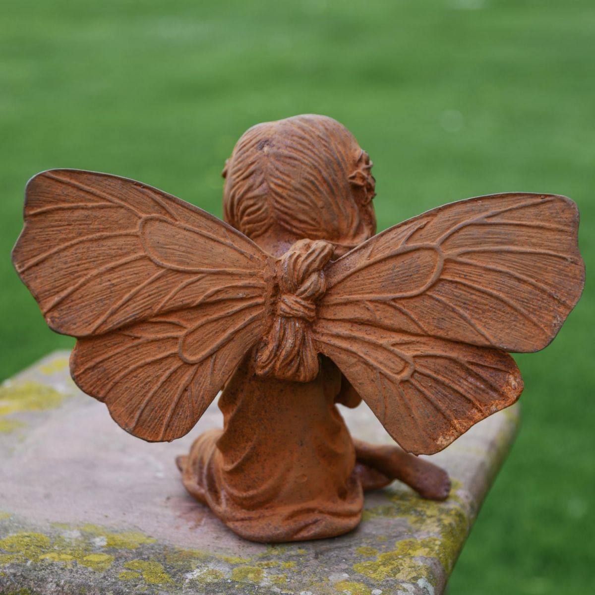 Reverse View of Rustic Cast Iron Fairy with Flower Sculpture Reverse View of Rustic Cast Iron Fairy with Flower Sculpture