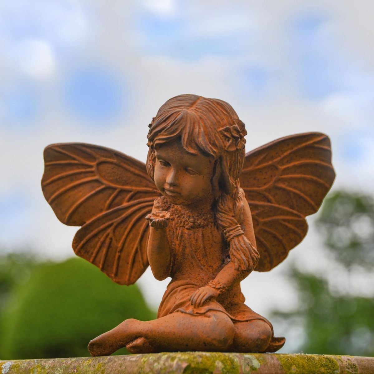 Rustic Cast Iron Fairy with Flower Sculpture in Situ Rustic Cast Iron Fairy with Flower Sculpture in Situ