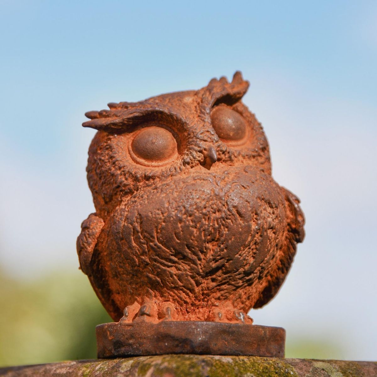 Rustic Cast Iron Great Horned Owl Sculpture in Garden Setting  Rustic Cast Iron Great Horned Owl Sculpture in Garden Setting