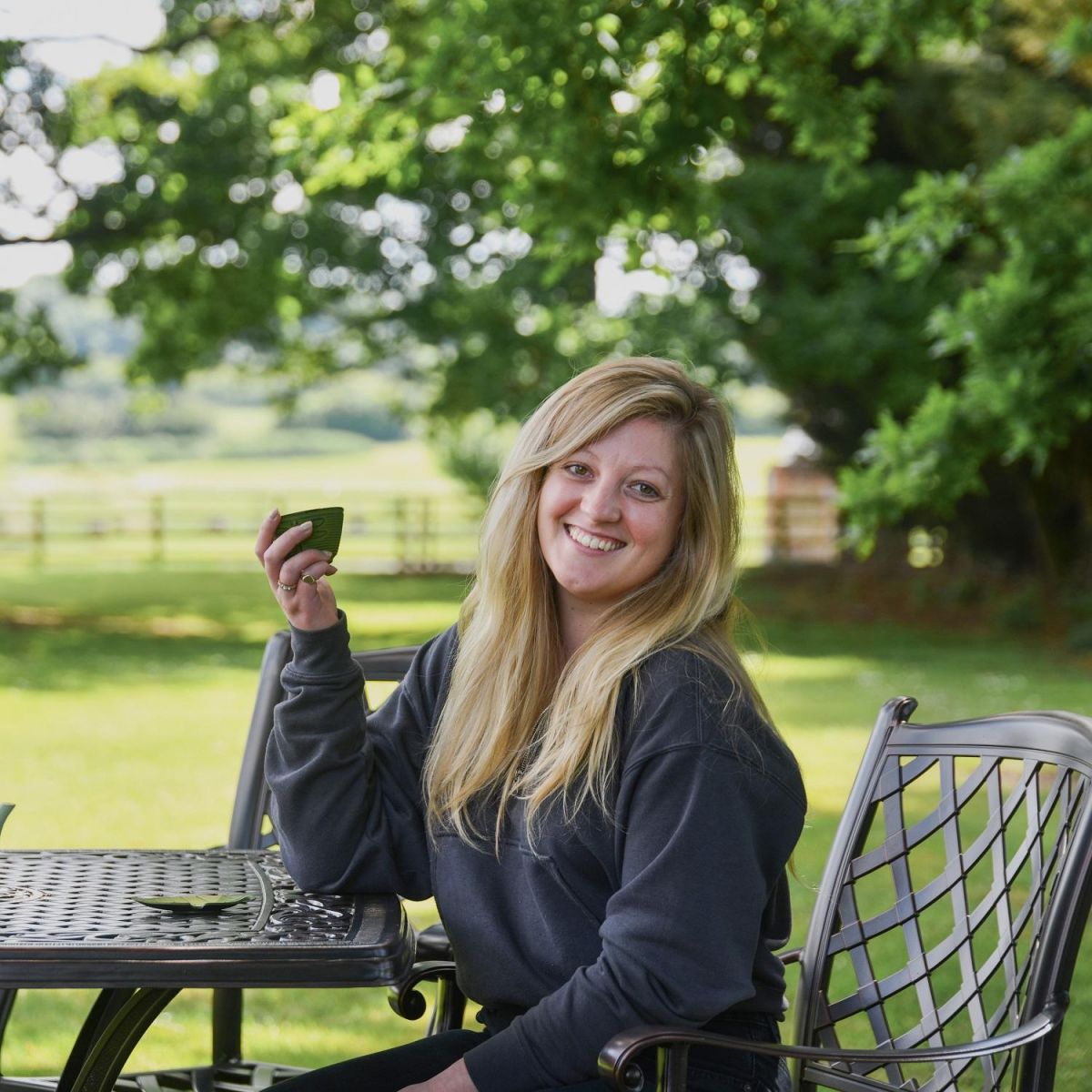 Female Seated at Hawkstone Antique Copper Set 
