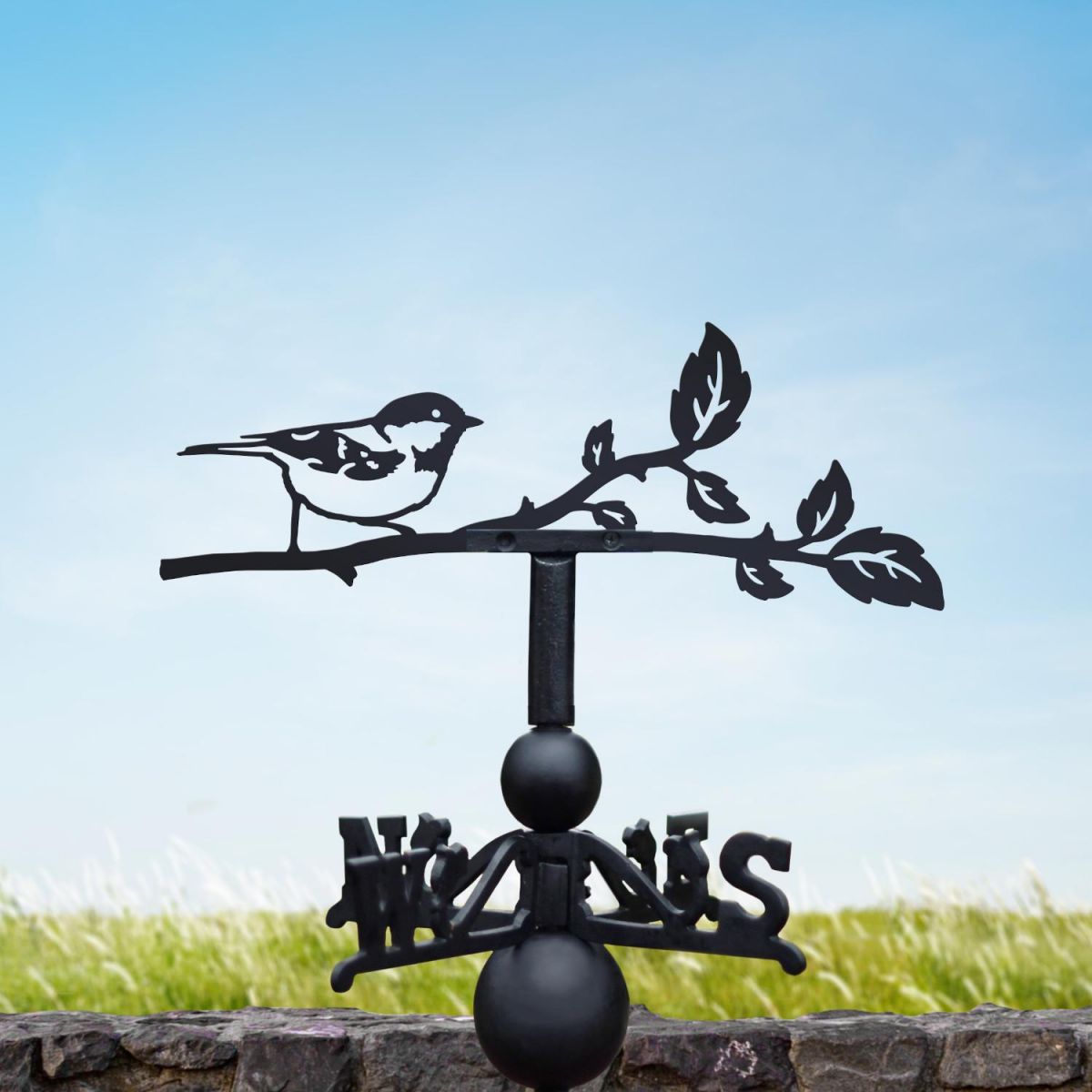Coal tit weathervane in a summery setting