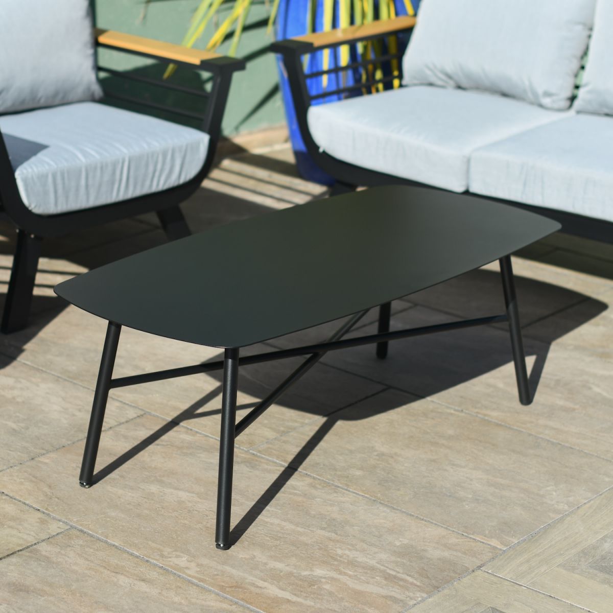 Close up of contemporary coffee table on outdoor sofa lounge set