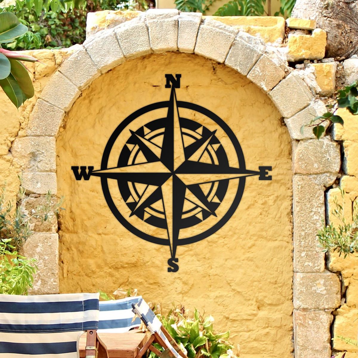 Compass Wall Art in Situ on a Yellow Garden Wall