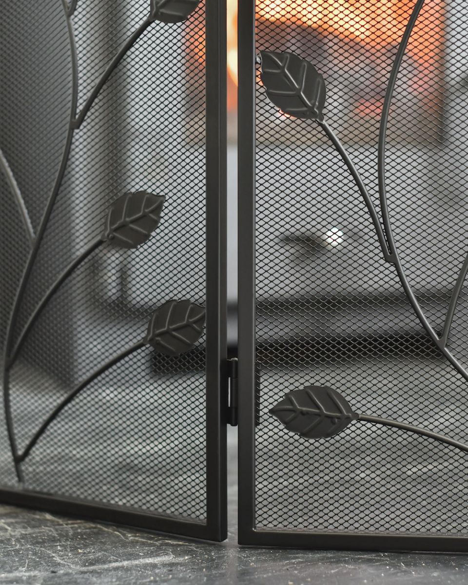 Close up of mesh detailing on four fold fire guard Close up of mesh detailing on four fold fire guard