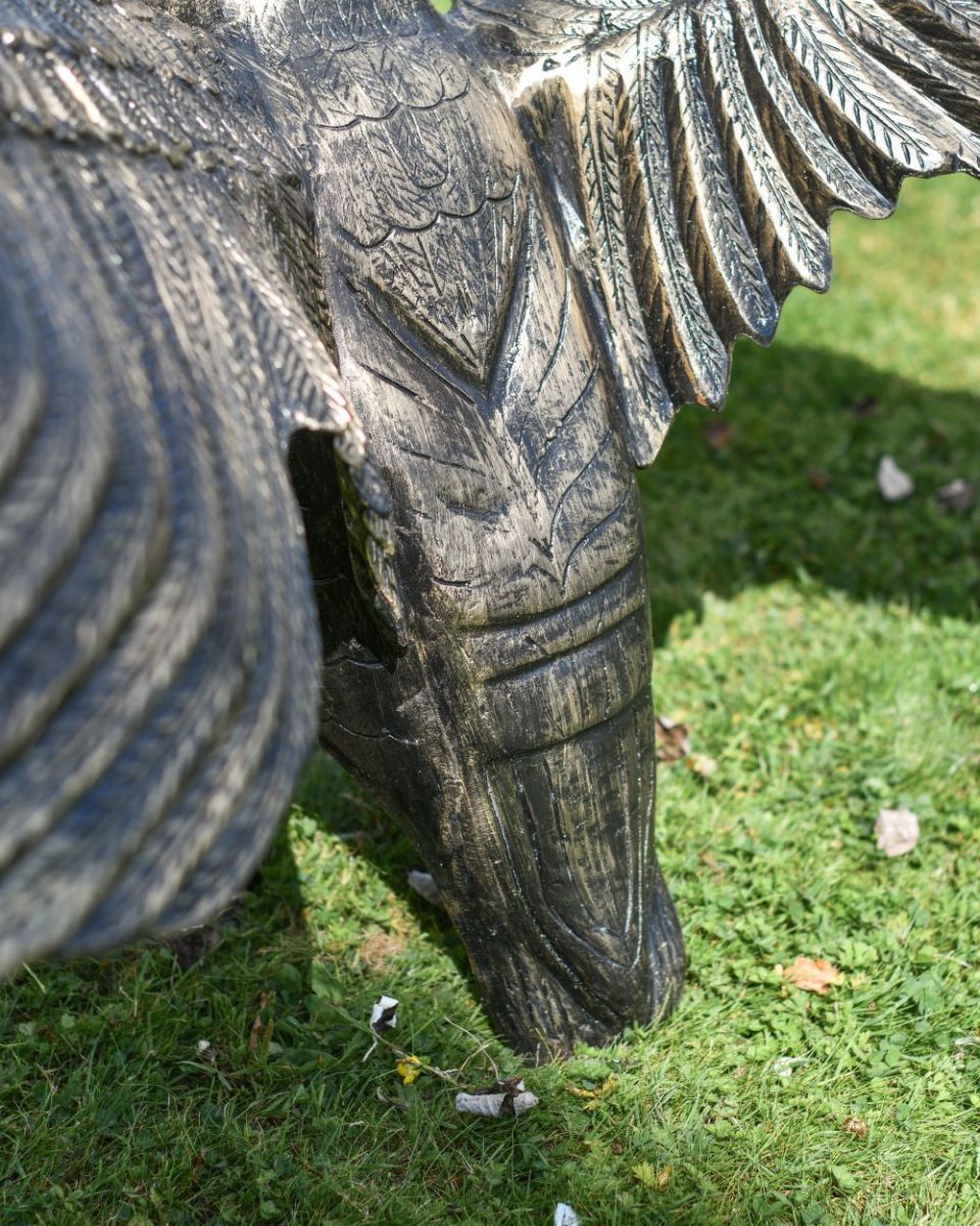 Close up of Black and Gold "Conqueror" Swan Sculpture tail