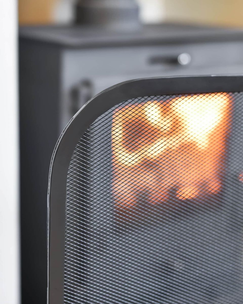 Close-Up of Arched Design on Contemporary Black Single Panel Fireguard with Mesh