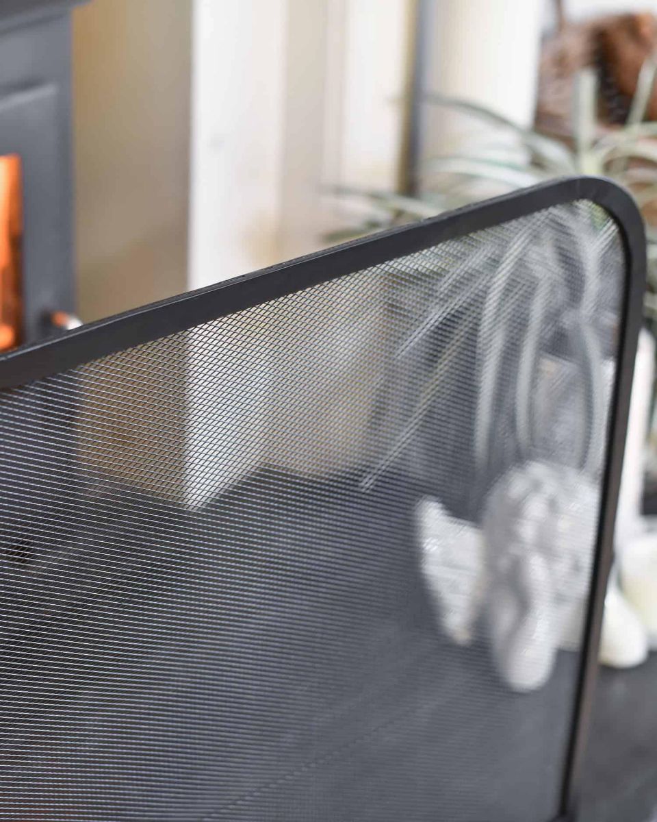 Close-Up of Contemporary Black Arched Single Panel Fireguard with Mesh